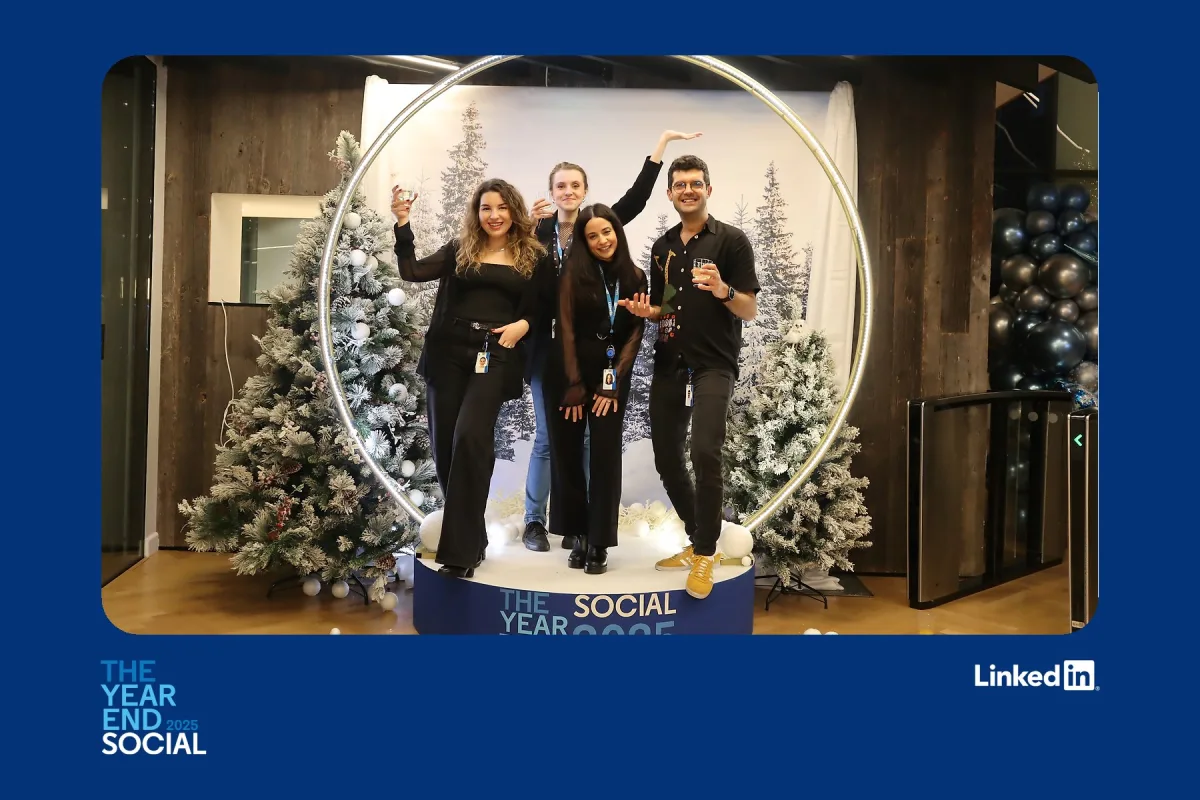 Christmas party photo booth print template with a snowy tree backdrop, guests inside a lit circular arch and festive event branding