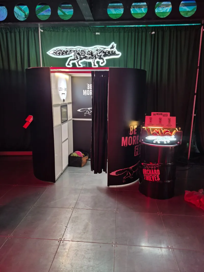 Fully branded enclosed photo booth with Orchard Thieves Be More Fox custom vinyl wrap at corporate event