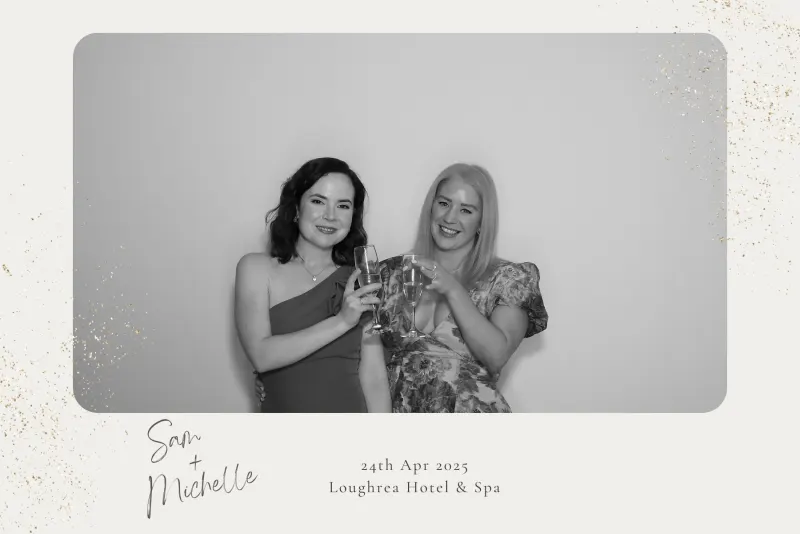 Wedding couple at photo booth with champagne at Loughrea Hotel