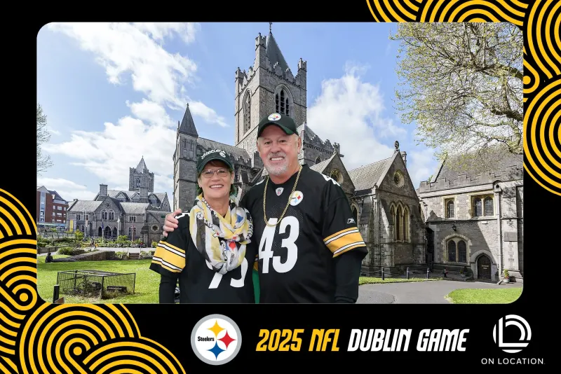 Couple at green screen photo booth with Christ Church Cathedral virtual background at NFL Dublin Game
