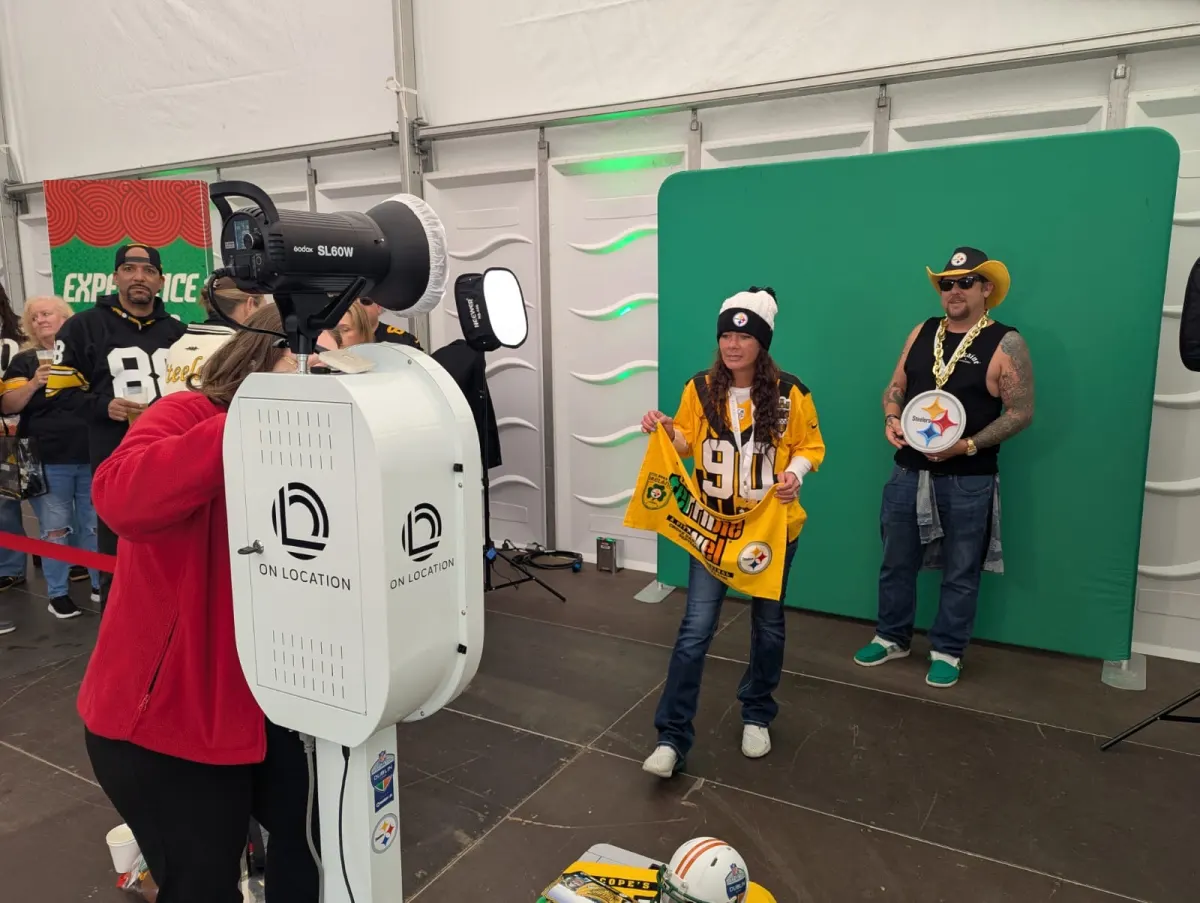 Green screen photo booth setup at NFL Dublin Game with professional lighting and camera equipment