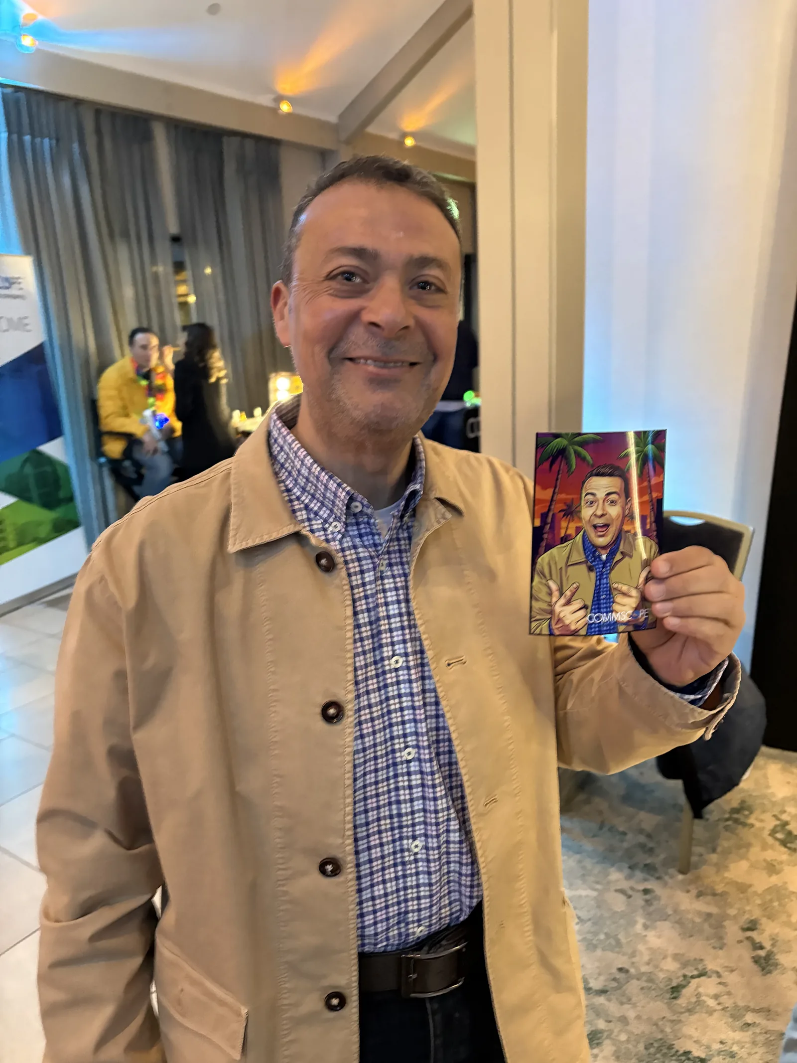 Corporate event guest holding an AI-generated trading card print from a Photobooth Guys booth in Ireland