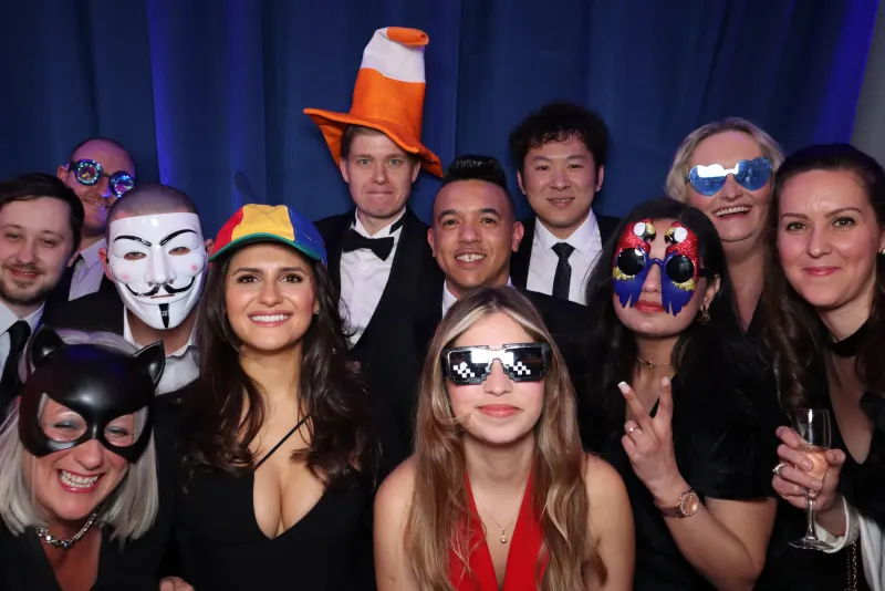 Group of friends posing with props at a hen party photo booth in Ireland